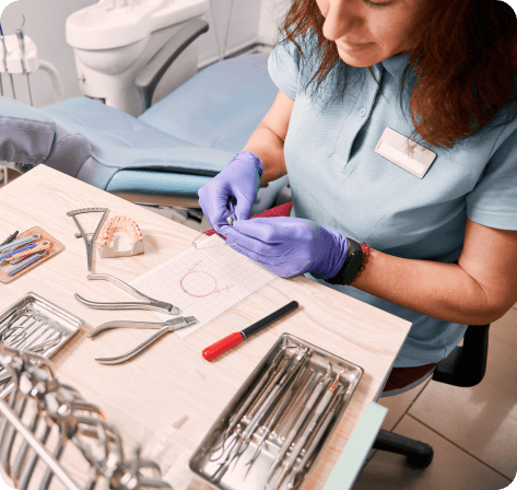 female orthodontist working dental office