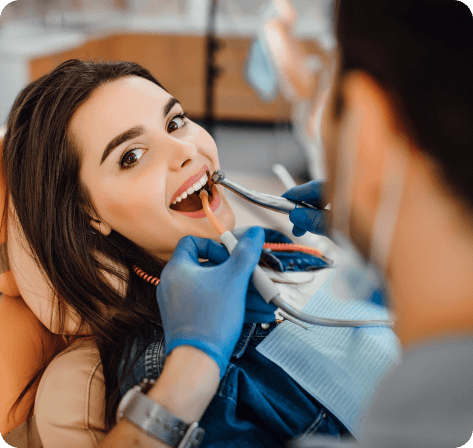 young female patient visiting dentist office